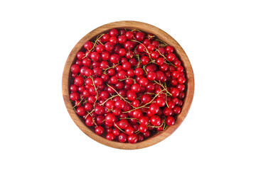 Fresh red currant in wooden bowl on dark table