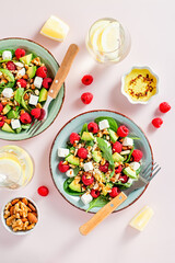 Light summer salad with raspberry, walnuts, avocado and cheese