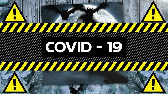 Animation of warning text covid 19, over bats, graveyard and moon