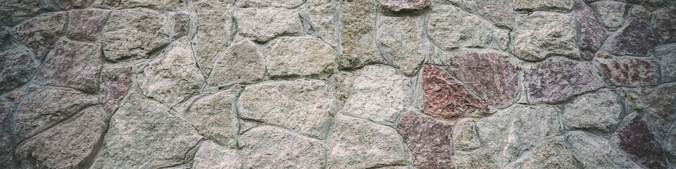 Grey stone wall with rough cobble mosaic wallpaper