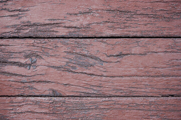 painted boards are old covered with brown paint