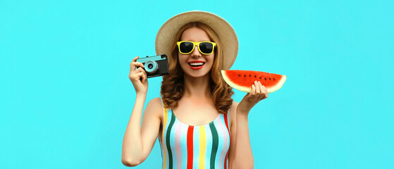 Summer portrait of happy smiling young woman with retro camera and slice of fresh watermelon...