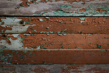 painted boards are old covered with brown paint