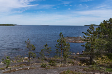 Fototapeta na wymiar Skerry of Ladoga. Stony lake shore on Great Ladoga Trail. Leningrad region. Russia.