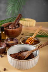 Ingredients for making homemade coffee skincare scrub on a table. Eco friendly cosmetics, vertical photo