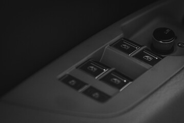 Obraz premium Black and white photo. Luxurious car interior. Car interior details. Happy interior. The concept of modern car interior design
