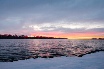 Scenic Sunset Snow-Covered Forest In Winter Season. Christmas Background.