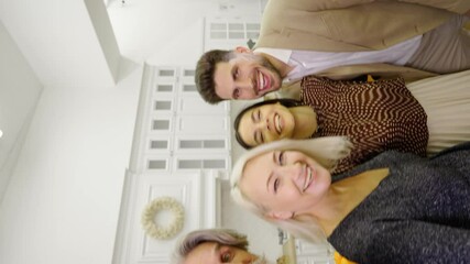 Happy family elderly parents and young couple in formal wear taking selfie on smartphone, looking at camera and having fun during holiday celebration at home. Video for the vertical story - Powered by Adobe