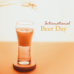 International Beer Day is a celebration on the first Friday of every August. A glass of cold light beer with foam on sunset summer background. The concept of home made natural beer production