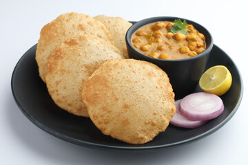 Indian food Puri & Potatoes served in a ceramic plate