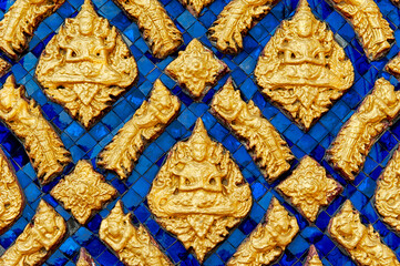 Panel of blue glass mosaic with the image of the Buddha in the lotus position of gold color