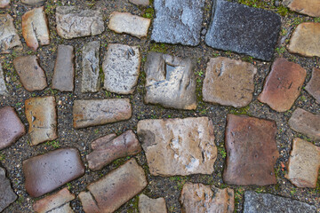 Paving stone texture. Masonry background. Paved road or stone pavement. Top view.