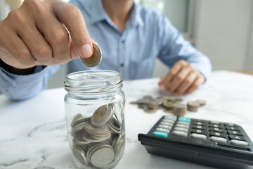 Fototapeta premium Businessman saving money concept.