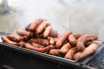 on the grill on an open fire fry meat sausages