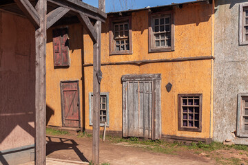 Fototapeta premium A street in front of an 18th century house wooden door in the piligrim porto by spring day