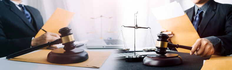 Business and lawyers discussing contract papers with brass scale on desk in office. Law, legal services, advice, justice and law concept