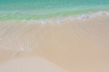 The surf of the Caribbean Sea. Azure sea and white sand.