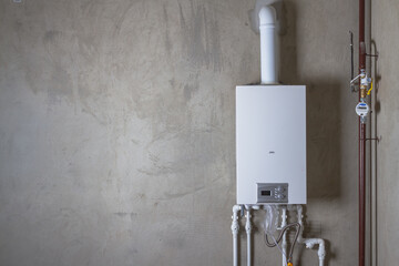 Double-circuit gas boiler in a new house for winter heating and water heating - Powered by Adobe