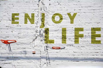 Picture of a bicycle and words depicting enjoy life.