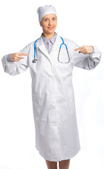 female doctor in a white coat and hat. points his fingers to the center, to himself, smiling at us. place for an inscription. isolated, white background