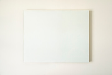 Empty canvas, poster, blank frame canvas, mock up, on a white wall, living room, home decoration template, front view