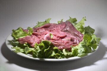 raw beef called 'Carne Salada' served with lettuce leaves