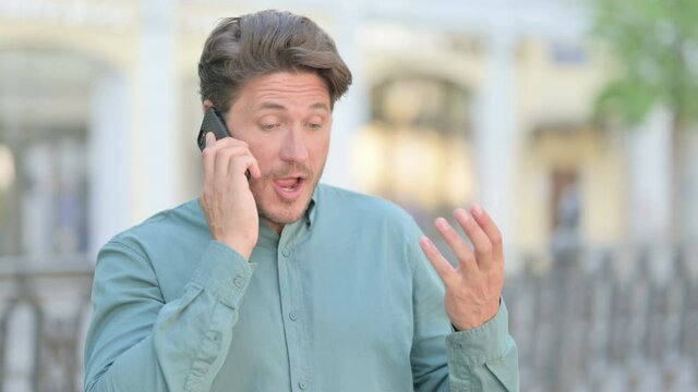 Outdoor Middle Aged Man Talking on Phone