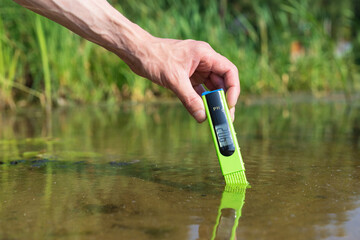 Measure water content with digital device. PH meter.