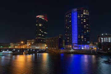 View of the Grand Rapids skyline from the river at night - Michigan - USA