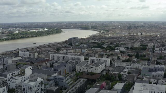 The beautiful french city Bordeaux on a warm and sunny summer day. The city is the center of the famous wine growing region. Drone Aerial views of the famous cityscape and the river Garonne.