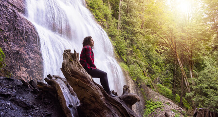 Woman watching the Waterfall in the Canadian rainforest. Bridal Veil Falls Provincial Park near Chilliwack, East of Vancouver, British Columbia, Canada. Nature Background © edb3_16