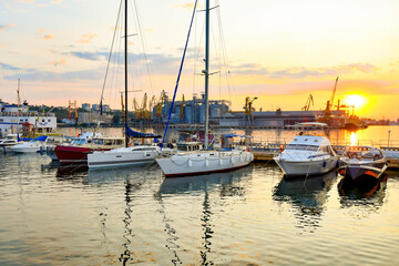 Fototapeta premium Private sailing yachts are moored in the sea at the pier.