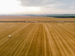 Drone Aerial View of a Field with Wheat bales