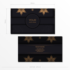 Business card with gold mandala and monogram on black background. Vector illustration.