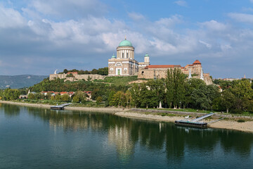Fototapeta na wymiar View on Esztergom Basilica at Castle Hill from a bridge across Danube, Hungary. The Primatial Basilica of the Blessed Virgin Mary Assumed Into Heaven and St. Adalbert was built in 1822-1869.