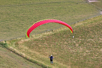Paraglider flying at Milk Hill, Wiltshire	