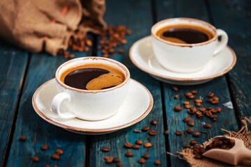 Cups of coffee on a rustic wooden background - obrazy, fototapety, plakaty