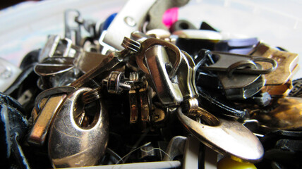 Fototapeta na wymiar Background of locks from clothes and jackets