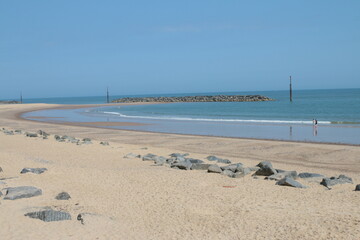 Beautiful landscape of stunning sandy vast beach in Sea Paalling bay in Norfolk East Anglia uk with blue skies in Summer sun and calm tide ocean  no people