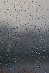 Raindrops running on the glass