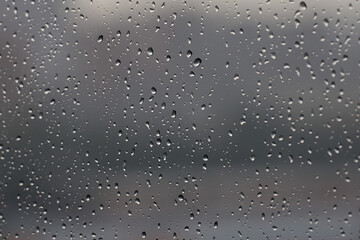 Raindrops running on the glass