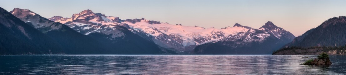 Panoramic View of Canadian Nature Landscape with glaciers and rocky mountains in the background. Garibaldi Lake, Near Whistler and Squamish, North of Vancouver, British Columbia, Canada. Sunny Sunset