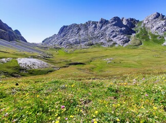 Fototapeta premium Central Massif and Vega de Liordes in the trail to Collado Jermoso, Picos de Europa National Park and Biosphere Reserve, Leon province, Spain