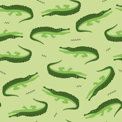 Animal seamless pattern and textile design. Vector illustration with cute green crocodile on light green background. Good for t-shirt design, fabric print, greeting card, wrapping, wallpapers.