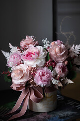 Beautiful bouquet of pink roses on a dark background, soft and romantic. Still life with a flowers....