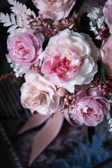 Beautiful bouquet of pink roses on a dark background, soft and romantic. Still life with a flowers. Still life with a bouquet.