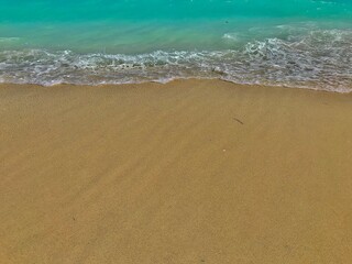 Fototapeta na wymiar beach sand and wave