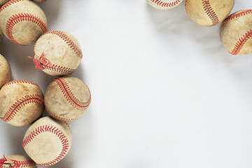 Baseball background with flat lay of old used balls isolated on white.