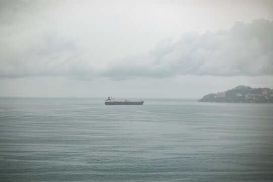 Boat in acapulco bay on a foggy day