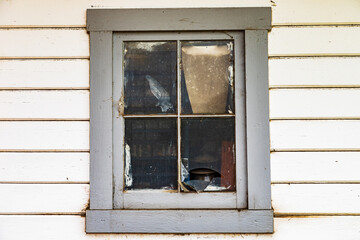A window on an old house in small town in the Palouse hills.